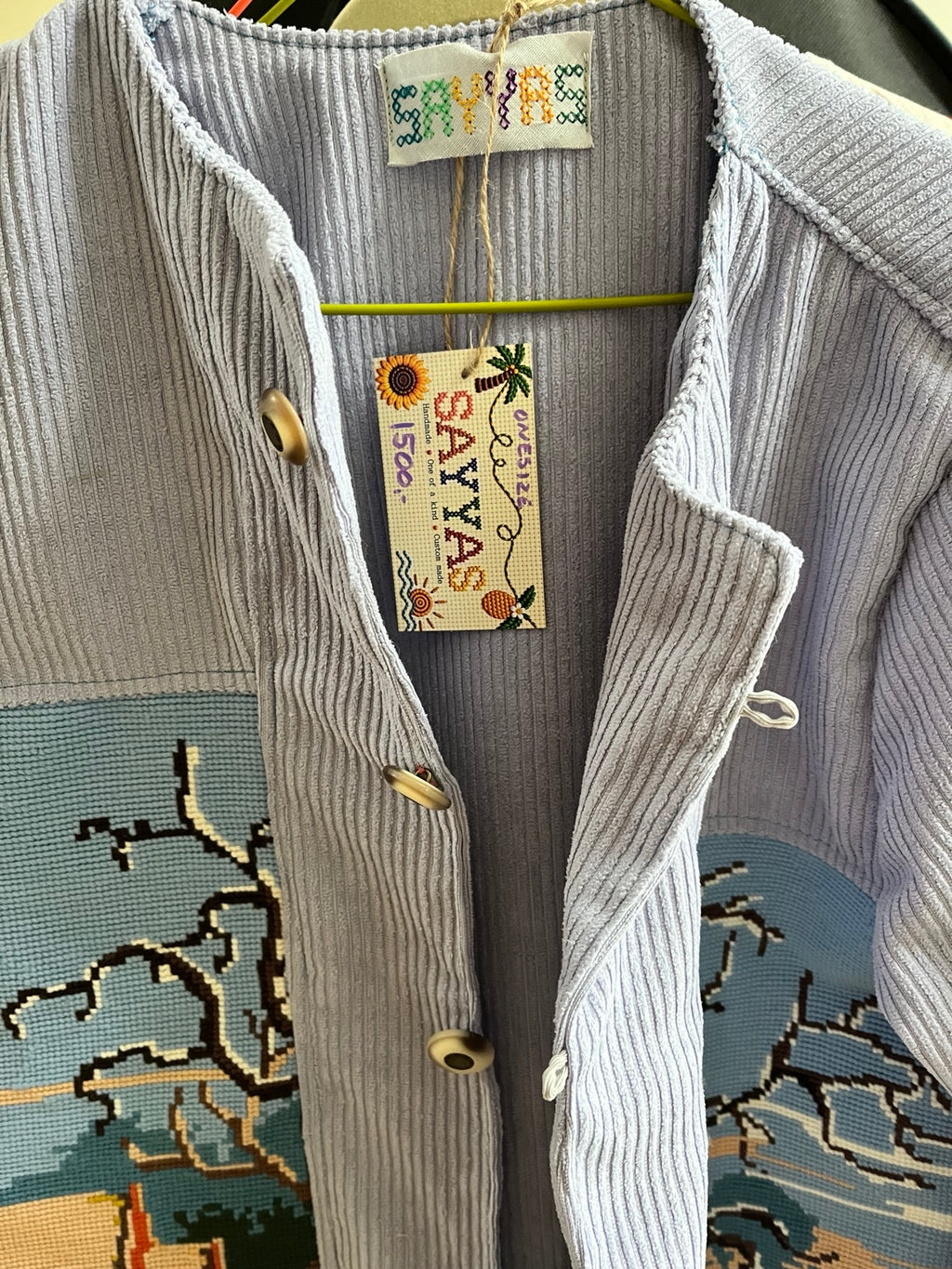 SAYYAS jacket label showing one size and price 1500