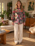 Front of dark floral shirt with embroidered floral appliqués