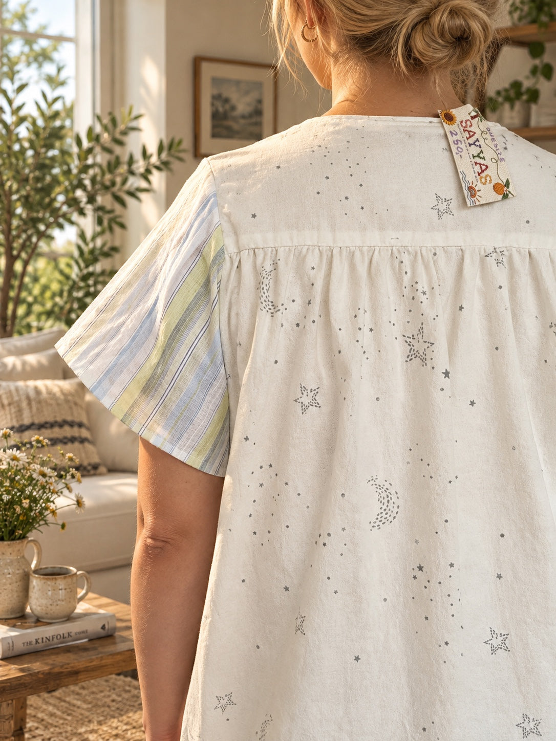 Tunic back neckline and one-size 250 price tag