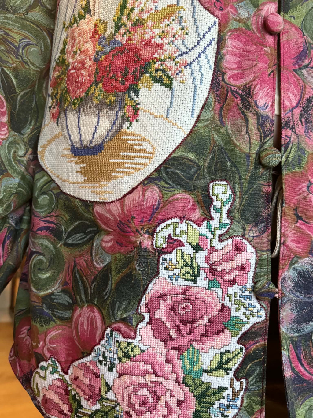 Close-up of rose and floral-vase embroidery